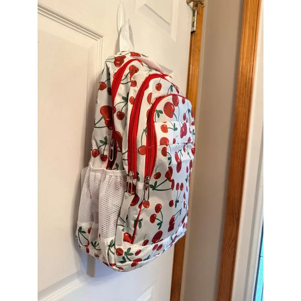 New white backpack cherry pattern.Padded back,multiple pockets,adjustable straps